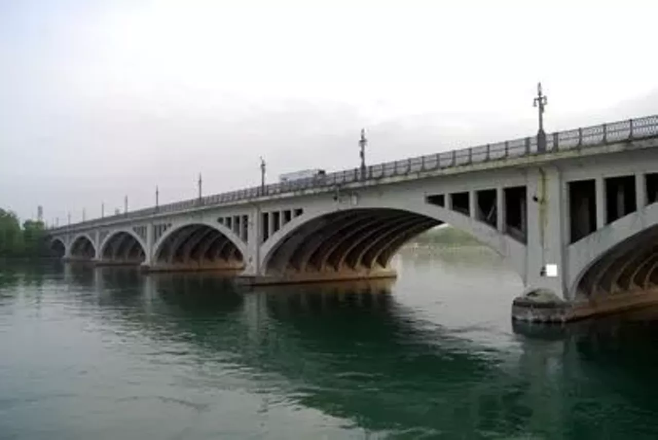 Meeting in D.C. The MacArthur Bridge, viewed from Gabriel Richard Park and looking out to Belle Isle, was the backdrop for a clandestine meeting between Lois Lane and a government contact. (Photo Credit: Belle Isle Conservancy)