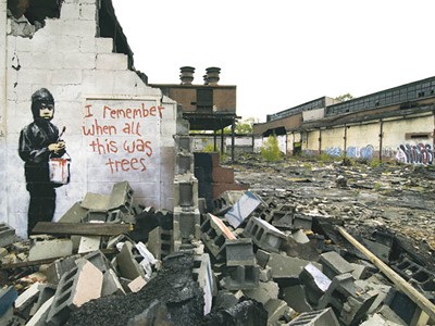 The Banksy at Detroit's abandoned Packard Plant before its removal.
