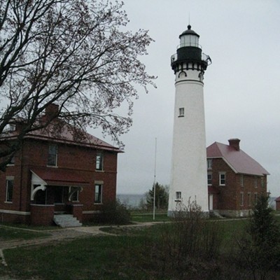 The Au Sable Point Light, with trees just beginning to bud.