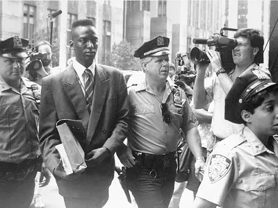 Defendant Yusef Salaam being escorted by police in 1990. The media circus was part of the problem.