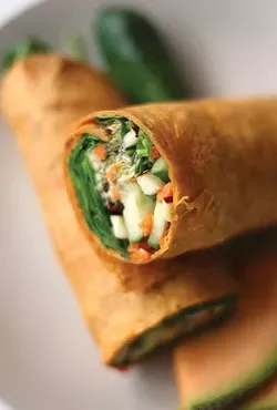 The Hippie Dippie Sh*t Man wrap: avacado, baby spinach, alfalfa sprouts, walnuts, dried cranberries, diced apples, shredded carrots and cucumber with raspberry vinaigrette rolled in lavash bread. - MT Photo: Rob Widdis