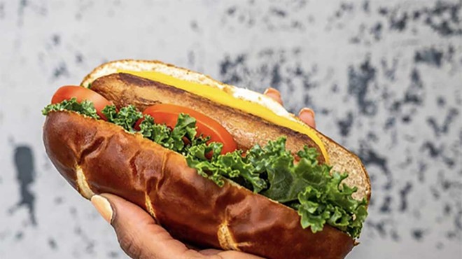 “The 313” is a Beyond sausage topped with kale, tomato, vegan mayo, and mustard on a pretzel bun.