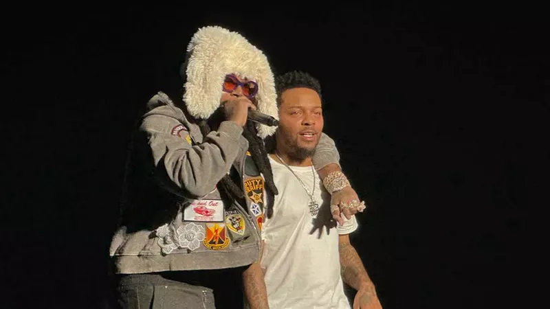 Icewear Vezzo gives Bow Wow a brotherly embrace at the Detroit stop of the Millennium Tour.