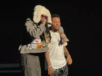 Icewear Vezzo gives Bow Wow a brotherly embrace at the Detroit stop of the Millennium Tour.