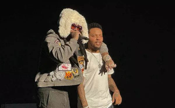 Icewear Vezzo gives Bow Wow a brotherly embrace at the Detroit stop of the Millennium Tour.