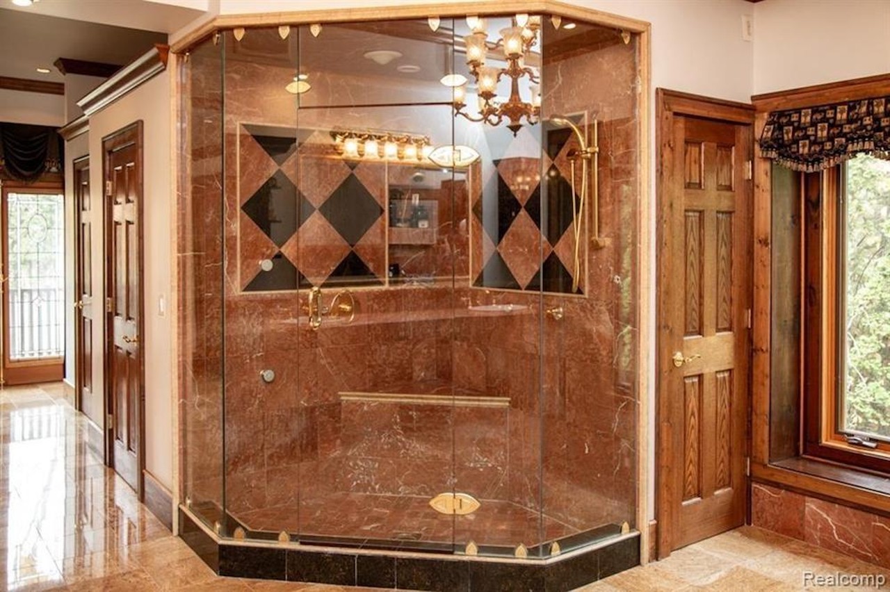 This $1.2 million marble-loving mansion in Grosse Ile has a sexy indoor pool