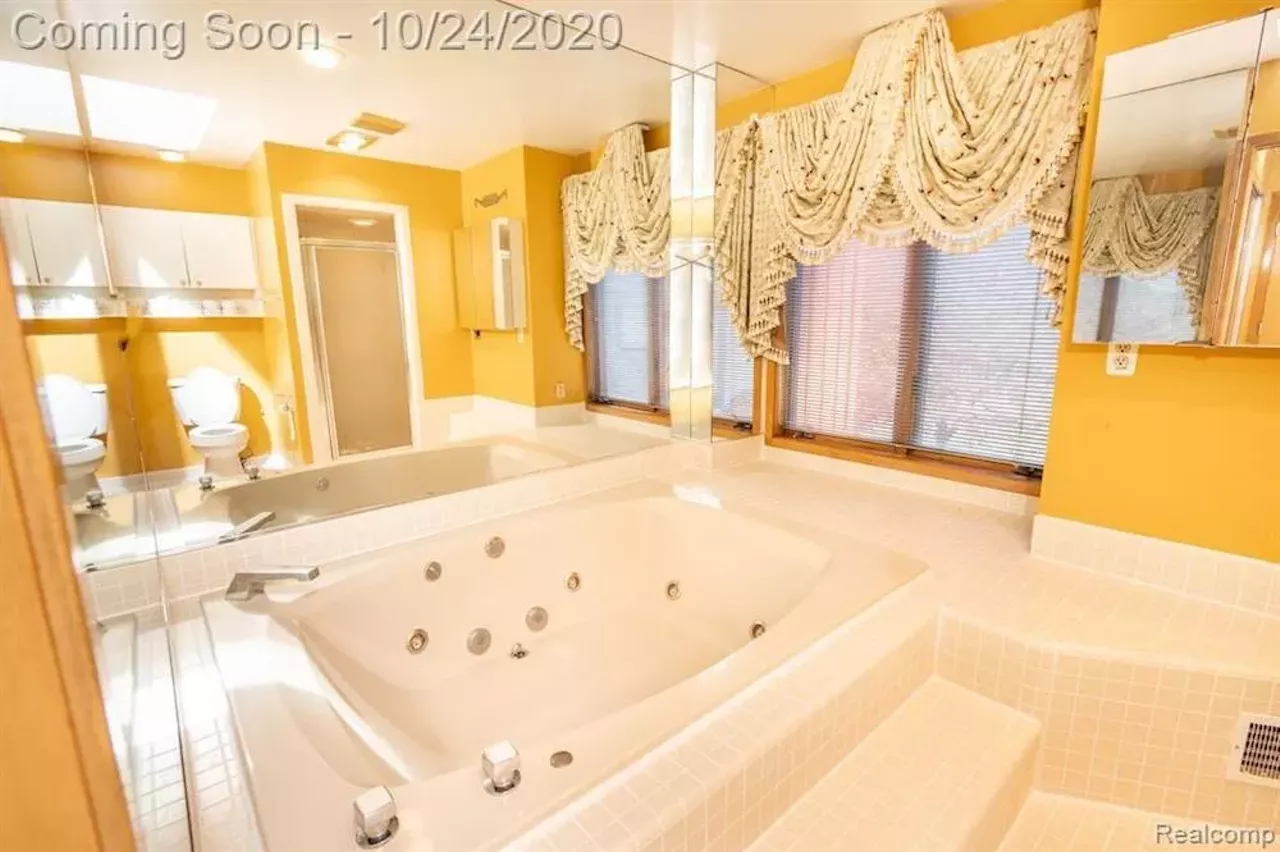 Image: This $550k metro Detroit home designed by the Palace architects has an indoor koi pond