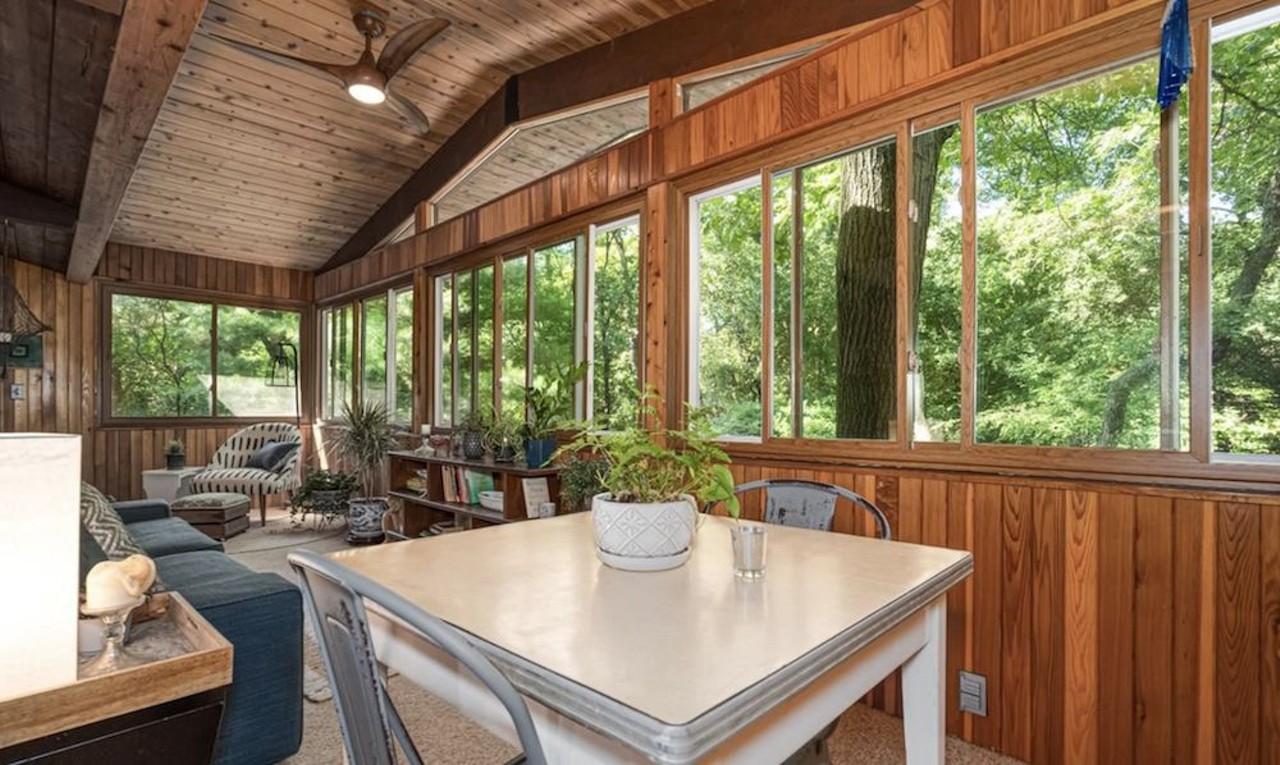 This $585k zen AF Ann Arbor home has a pergola and koi pond