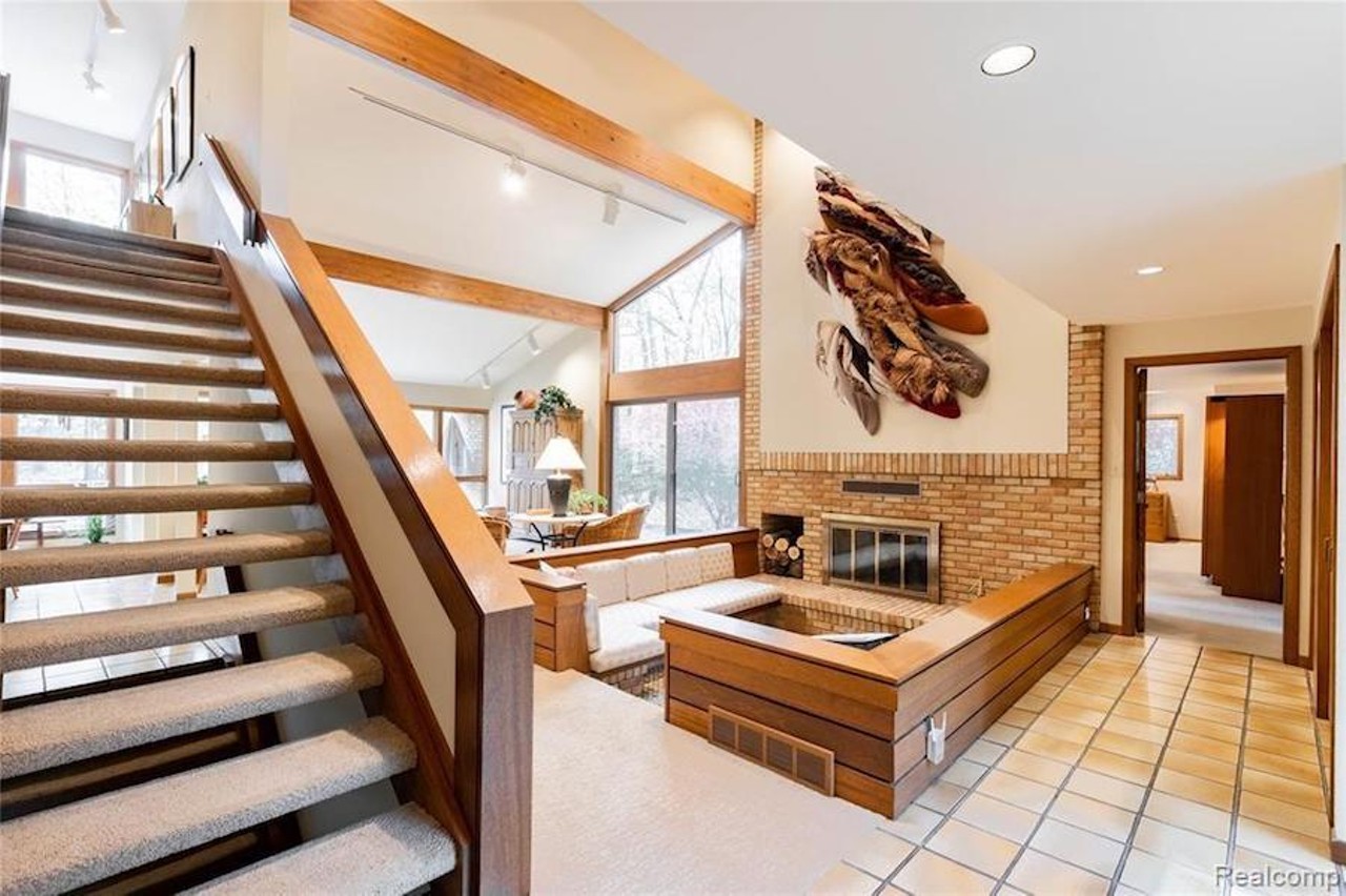 This custom $649k home in Grosse Ile has a fabulous conversation pit