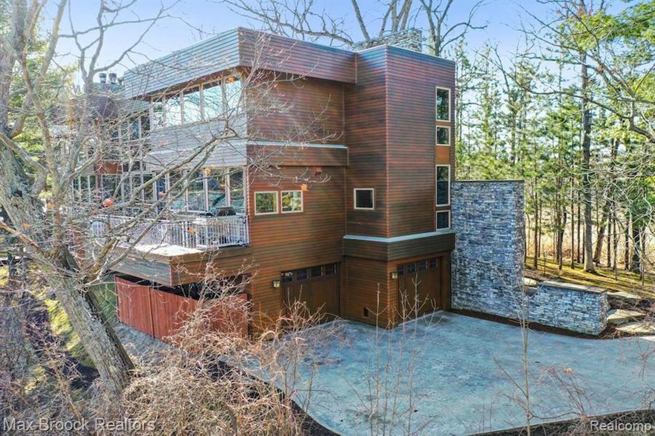 This custom 'organic contemporary' home on Michigan's Blain Island has strong Y2K energy