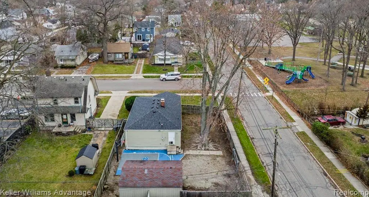This Ferndale 'bro' pad has Detroit Lions basketball court and is listed at $165K