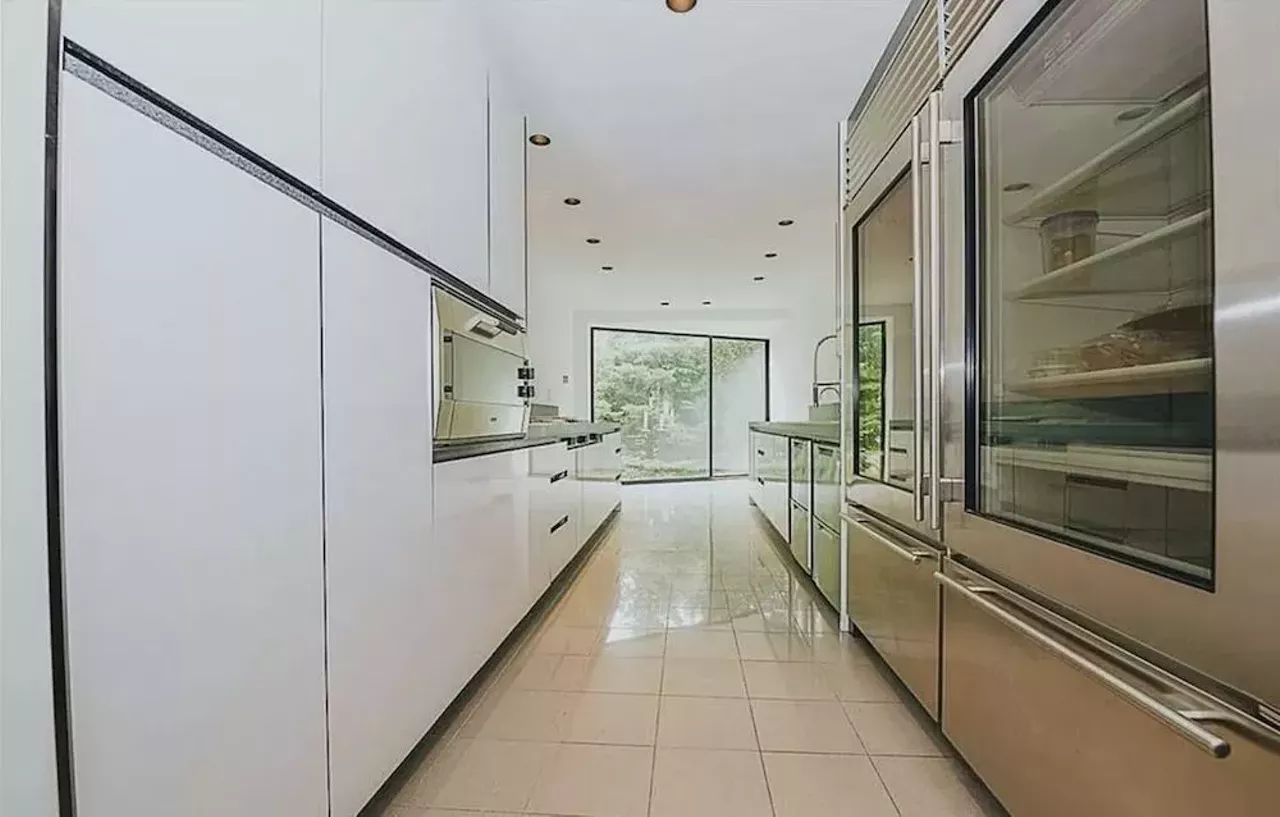 Image: This vertical Franklin Michigan home designed by Sigmund Blum is a modernist's wild dream &#151; and it keeps dropping in price