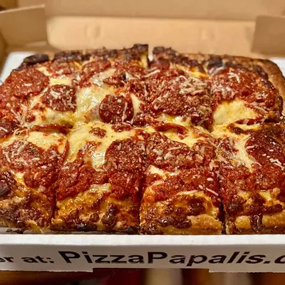 #21 PizzaPapalis Multiple locations; pizzapapalis.com Known for its Chicago-style deep dish, PizzaPapalis introduced its take on Detroit-style pizza in 2020. It comes in one size, with eight large slices. Their version sticks to the basics — a thick, rectangular pie with a crispy-edged crust and a classic cheese-and-sauce layering. The dough is surprisingly airy for a deep-dish style, giving each bit a nice contrast between the soft interior and the caramelized edges. The flavor of the cheese and sauce is solid, but the portions are light, leaving some bites feeling dry.