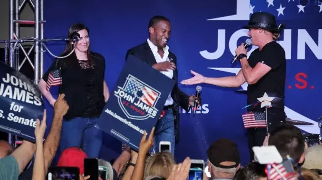 John James, center, who ran for U.S. Senate, was endorsed by Kid Rock, right, who didn't run for Senate but pretended to.