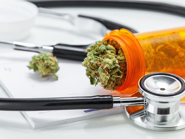A doctor in Northern Michigan is suspended for two years after it was revealed he approved 22,000 medical marijuana applications in 12 months.