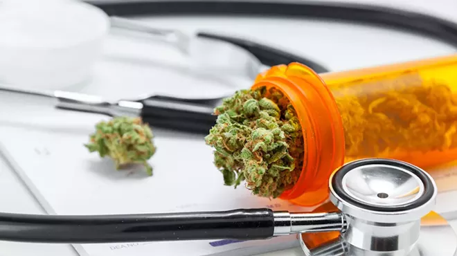 A doctor in Northern Michigan is suspended for two years after it was revealed he approved 22,000 medical marijuana applications in 12 months.