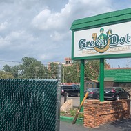 Court orders fence built in Detroit's Green Dot Stables parking lot removed
