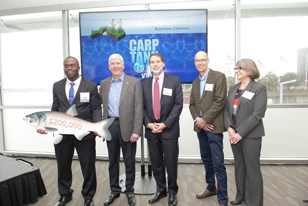 Edem Tsikata of Boston, Mass. accepts the grand prize at the Carp Tank from Gov. Rick Snyder, David Lodge, Jeff DeBoer and Dr. Denice Shaw. - Courtesy photo