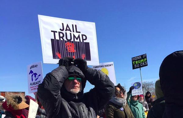 Hundreds of protesters met Trump on his first visit to Michigan. They'll be out again when the president comes to Washington Township this Saturday. - VIOLET IKONOMOVA