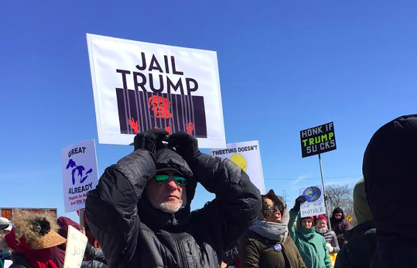 Hundreds of protesters met Trump on his first visit to Michigan. They'll be out again when the president comes to Washington Township this Saturday. - Violet Ikonomova