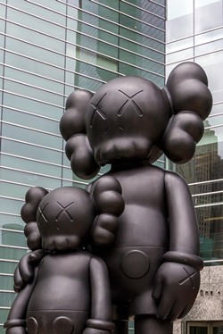 "Waiting," statue by artist KAWS. - Courtesy photo
