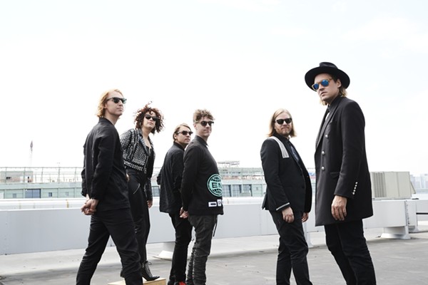 Relish in the glitter and gloom of Arcade Fire's existential crisis at DTE Energy Theatre