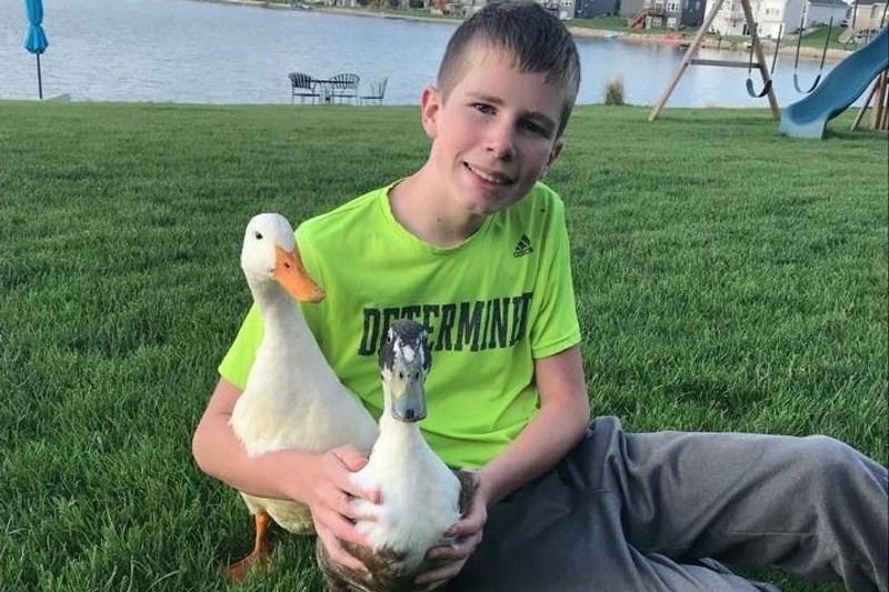 Dylan with his emotional support ducks, Nibbles and Bill. - Photo via GoFundMe