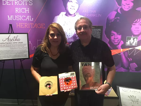 Denise and Dan Zieja have loaned boxes of Aretha Franklin memorabilia to the Detroit Historical Museum. Denise holds the "Respect" test pressing in her right hand, and the final version in her left. - Lee DeVito