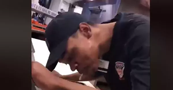 Comerica Park employee arraigned after allegedly spitting on pizza in viral video