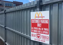 An apparently inaccurate warning at the McDonald’s in Midtown. According to people who’ve been victimized by Breakthrough, even customers can get towed here. - Violet Ikonomova