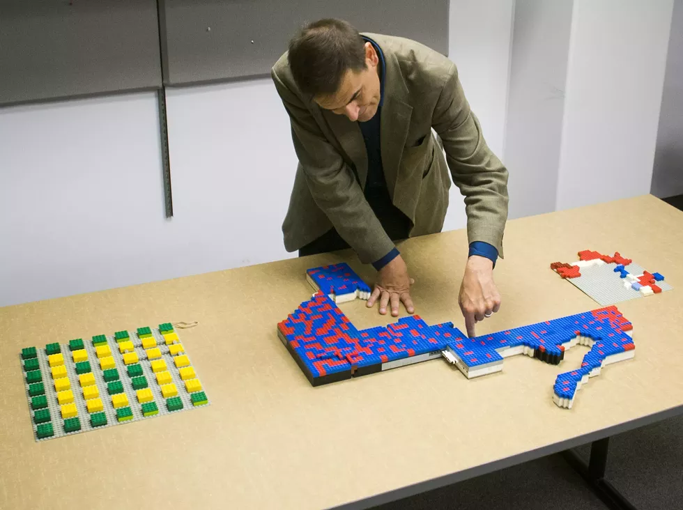 Wayne State University associate political science professor Kevin Deegan-Krause uses Legos to demonstrate gerrymandering. - Tom Perkins