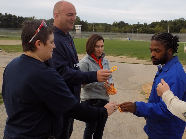 Jason Carr passes out ChadTough bracelets to inmates at Cotton. - COURTESY OF CHADTOUGH