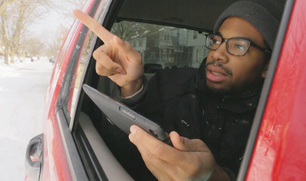 A Detroit resident tracks housing conditions as part of a citywide property survey in 2014. - Screengrab, Blight Removal Task Force video