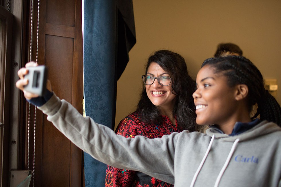 Teenager Carla Underwood, who volunteered for Tlaib’s campaign, poses for a selfie with the new congresswoman. She says she sees herself in her newly elected representative. ”I always thought this was so far away from me. Untouchable,” she says. “The government was far away and separate from my life here in Detroit. In many cases, people aren’t represented like they should be represented. Rashida gives me hope that I can do this too if I wanted to. I always thought of this as a ‘them’ thing. Not something that someone like us from Detroit could achieve.” - ERIK PAUL HOWARD