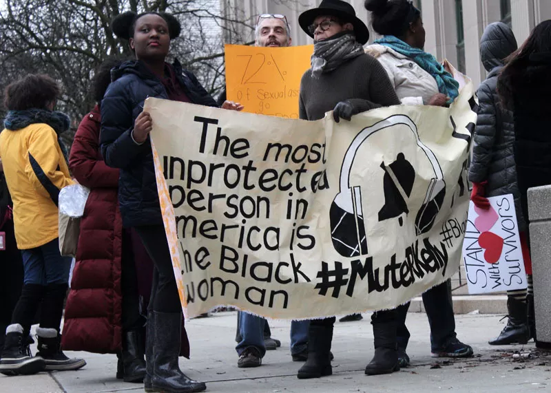 A #MuteRKelly protest held outside a concert at Detroit’s Little Caesars Arena last year. - Scott Zochowski