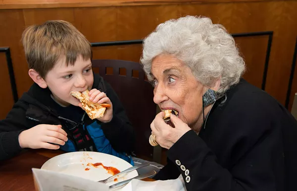 Olga Loizon snacking with a tiny human. - Courtesy photo