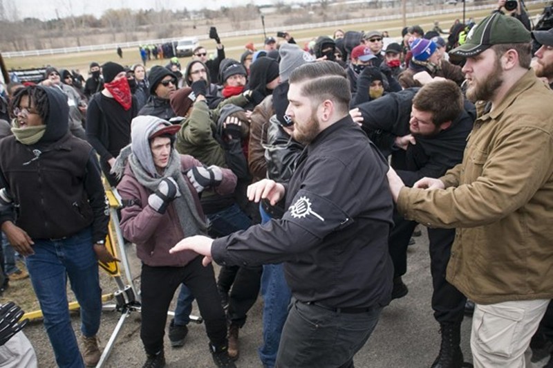 A neo-Nazi group and anti-fascist protesters clash at Michigan State University. - TOM PERKINS