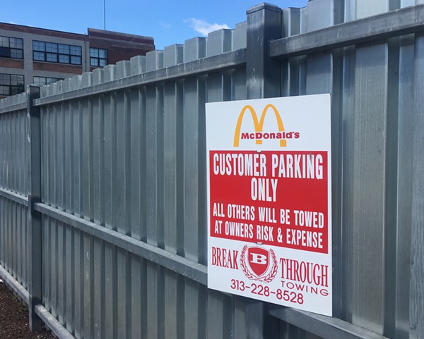 An apparently inaccurate warning at the McDonald’s in Midtown. According to people who’ve been victimized by Breakthrough, even customers can get towed here. - VIOLET IKONOMOVA