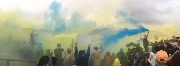 Inside Detroit City FC supporter section. - Farris Khan