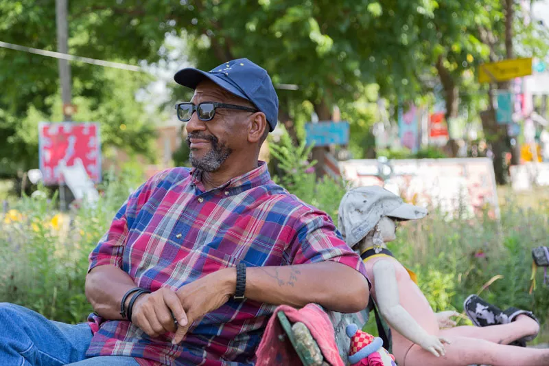 Tyree Guyton at his creation, the Heidelberg Project. - Tim Johnson