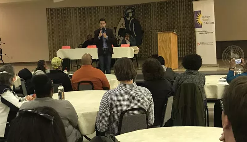 Igor Volsky with the group Guns Down America spoke at a town hall meeting Monday night in Flint. - Sam Inglot/Progress Michigan