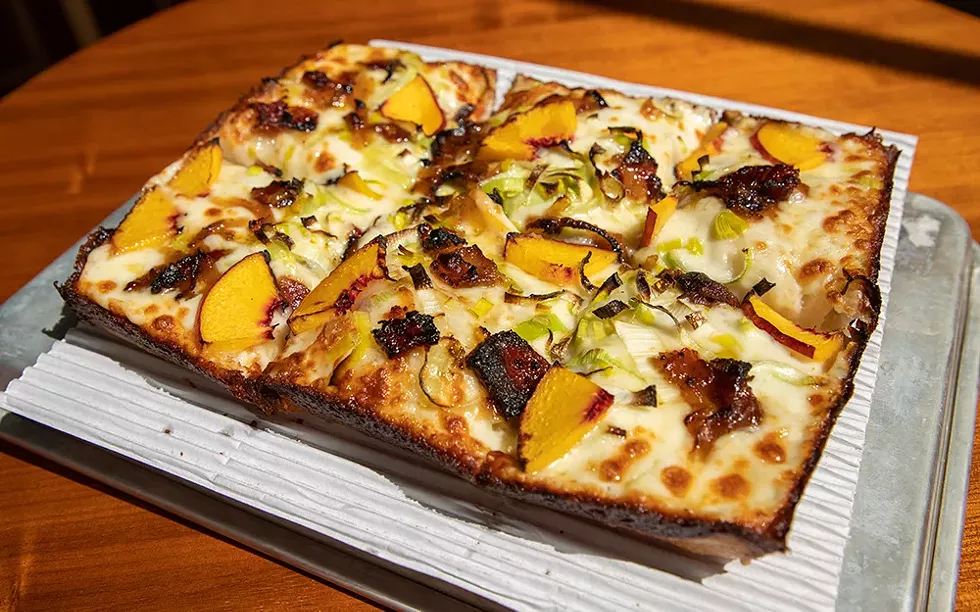 A new spin on an old classic: The Peach Pit from Michigan & Trumbull features peaches, leeks, bacon jam, and honey drizzle. - BRIDGET EKIS