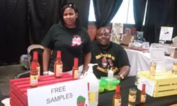 Roosevelt and D'Ette Walton of Ypsilanti, selling their Poppa's Gourmet Hot Sauce. - Serena Maria Daniels