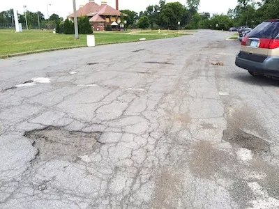 No money has been spent on the crumbling Vista Drive and derelict concessions building on the island's east side, away from the Grand Prix's footprint. - Photo by Tom Perkins