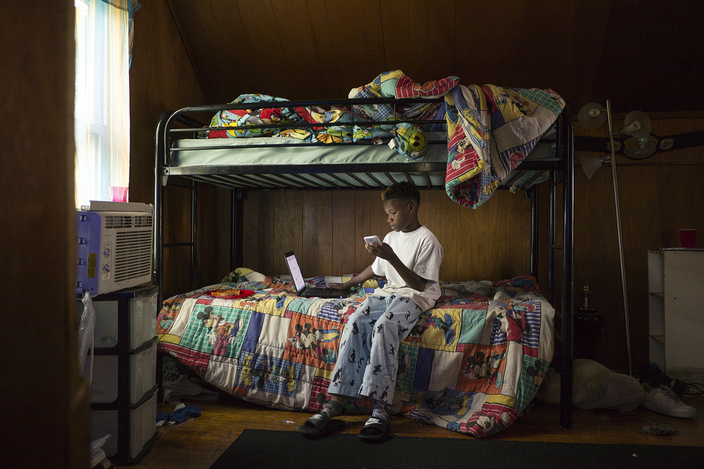 Shakiya Robertson's son Kye'Ren hangs out in his bedroom, which he shares with his older brother Ky'Shaun. - Iain Maitland