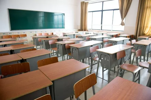 No, it's not a DPS classroom; it's stock art. How can you tell? No mushrooms growing in wall, clearly fewer than 30 desks, and lack of rags stuffed in broken windows to keep out breeze.