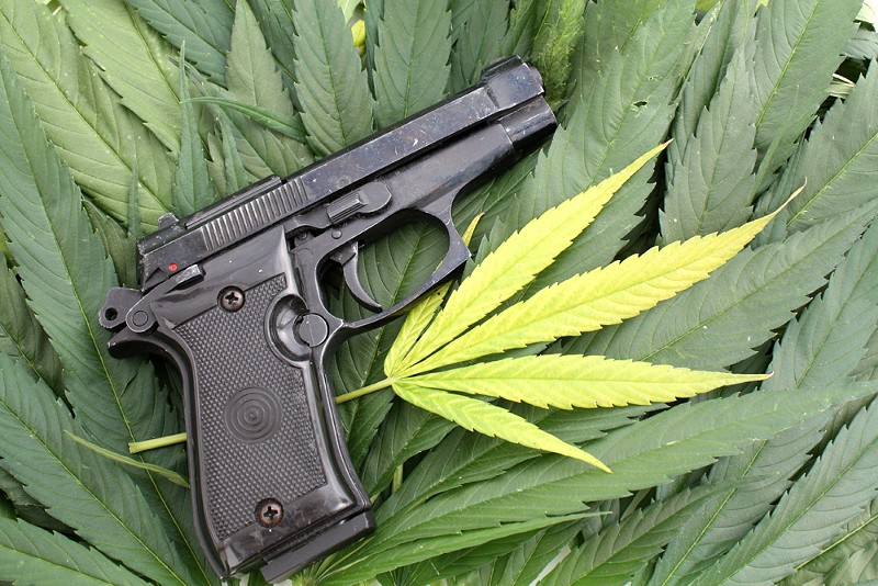 On the federal level, marijuana is still illegal, and it's a felony punishable by up to 10 years in prison to smoke pot and buy or own a gun. - Shutterstock