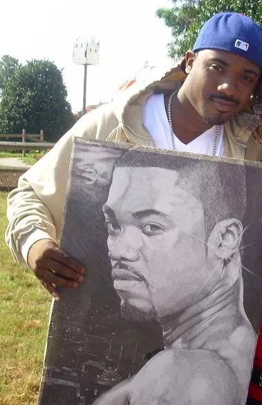 Ray-J holding a picture of Ray-J - Photo via Wikipedia