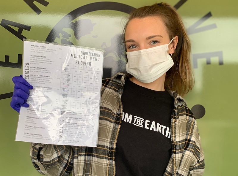 From the Earth employee holding a laminated menu. - From the Earth