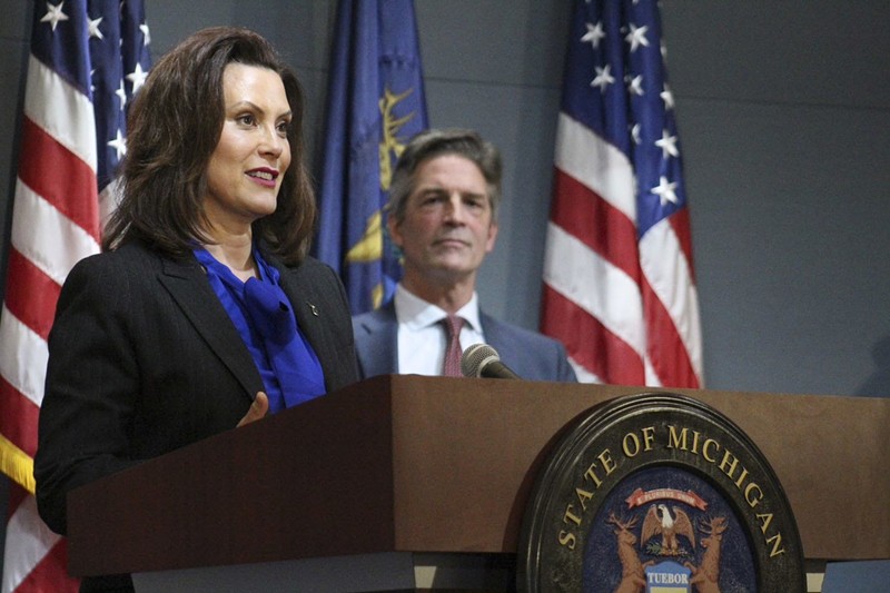 Gov. Gretchen Whitmer and Gerry Anderson, executive chairman of DTE, at a press conference Monday. - State of Michigan